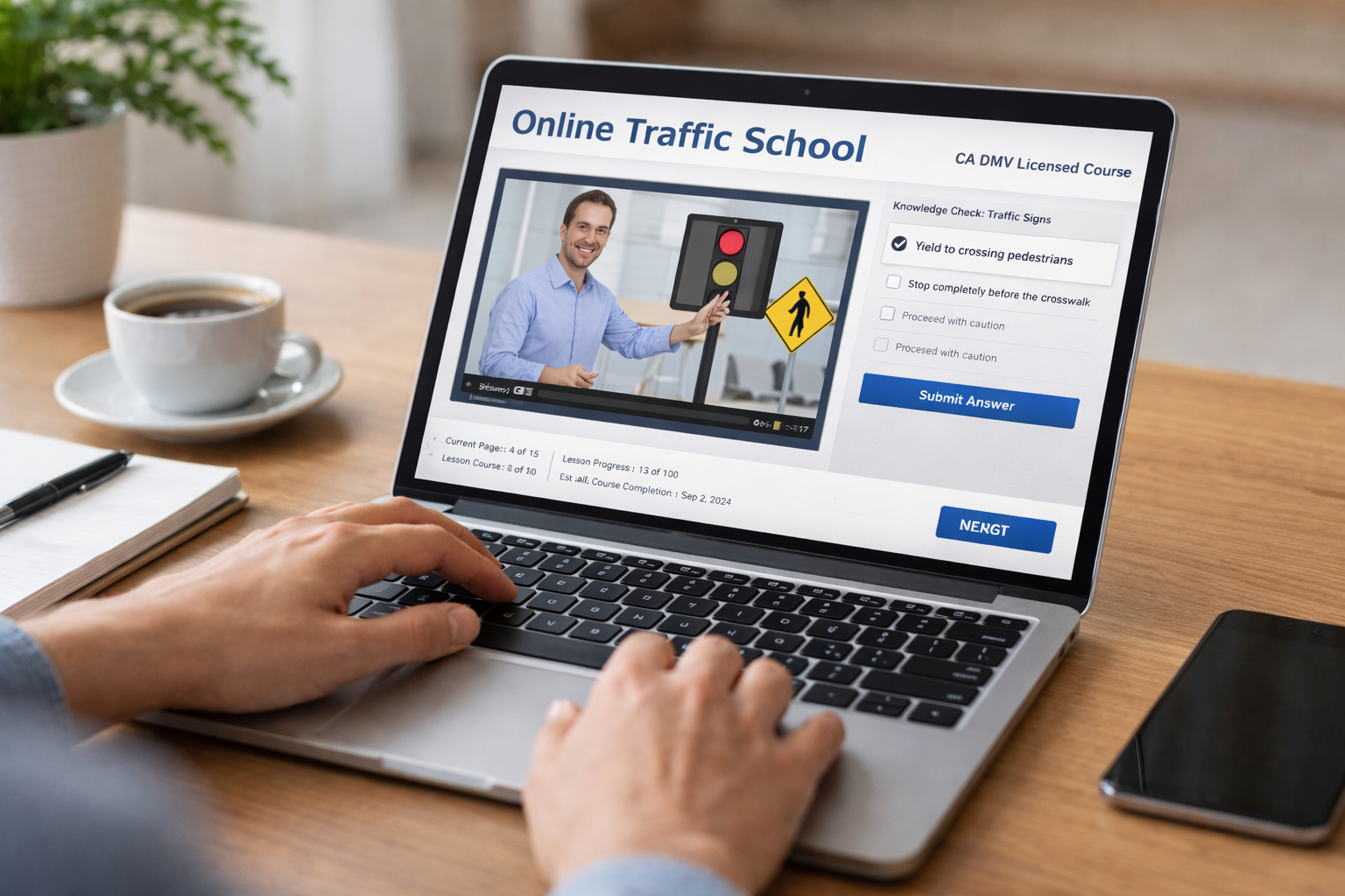 Laptop screen showing an online driver education course video with a traffic-sign knowledge check quiz